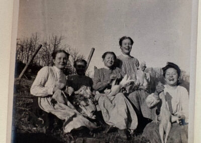Group of community members working together to prepare chickens.
