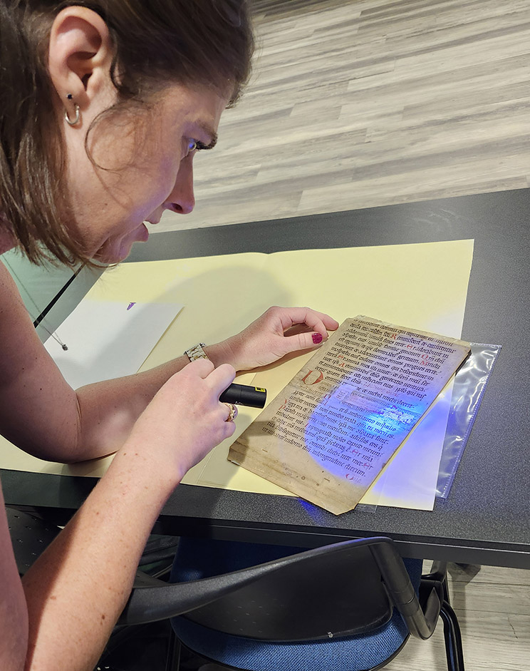 manuscript_leaf_study_ Dr. Davies using infrared light to examine a manuscript leaf